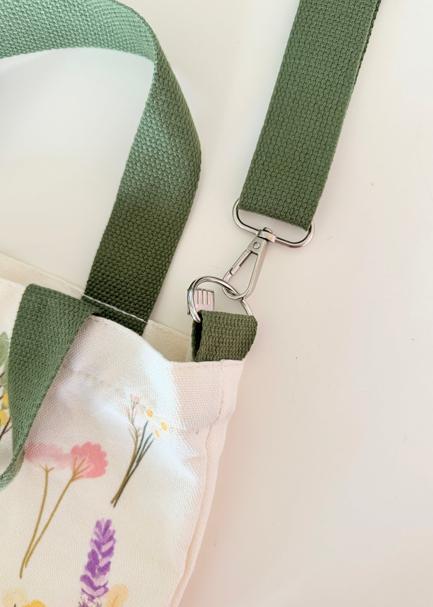 Floral print tote bag with green straps