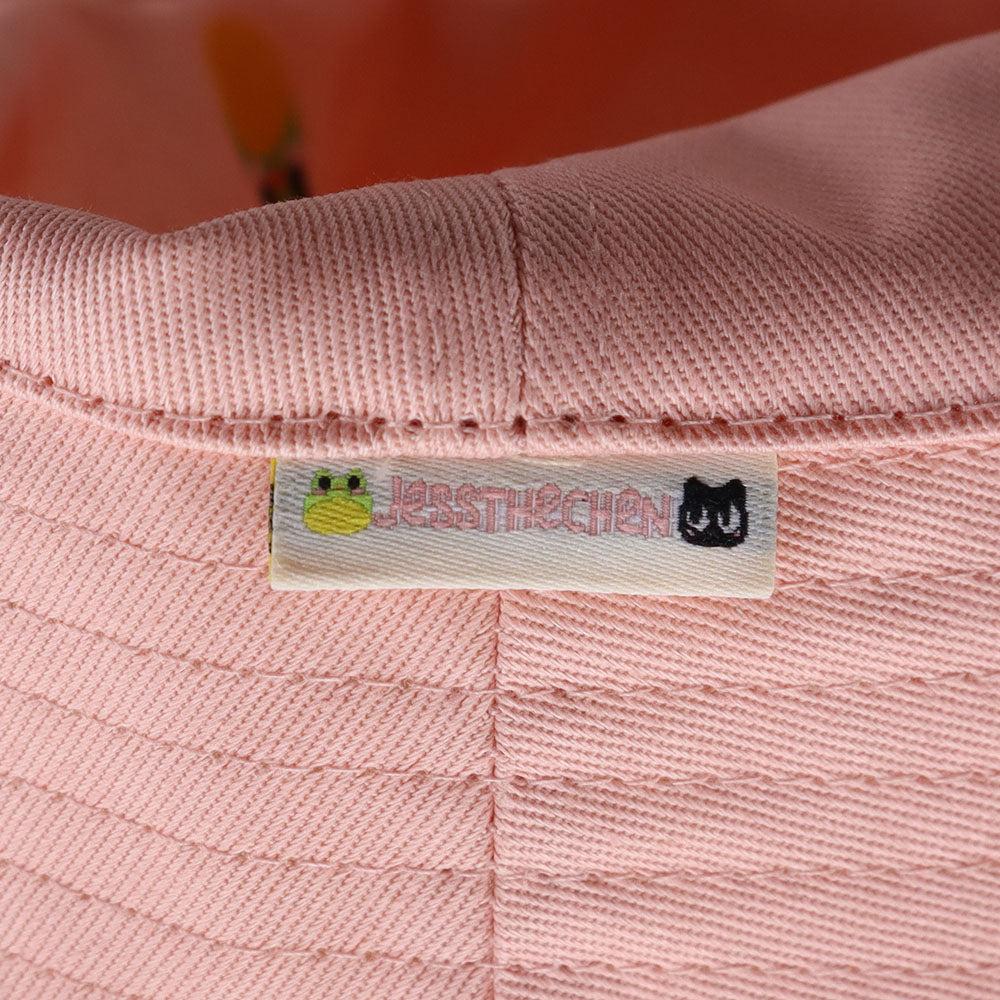 Pink frog bucket hat with label