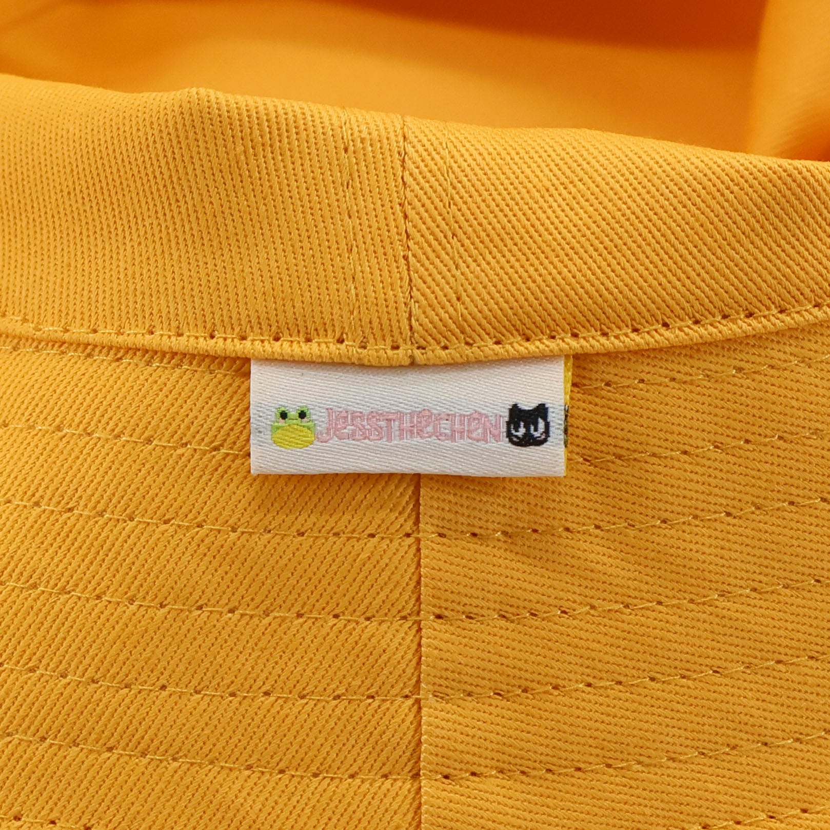Yellow duck bucket hat with logo