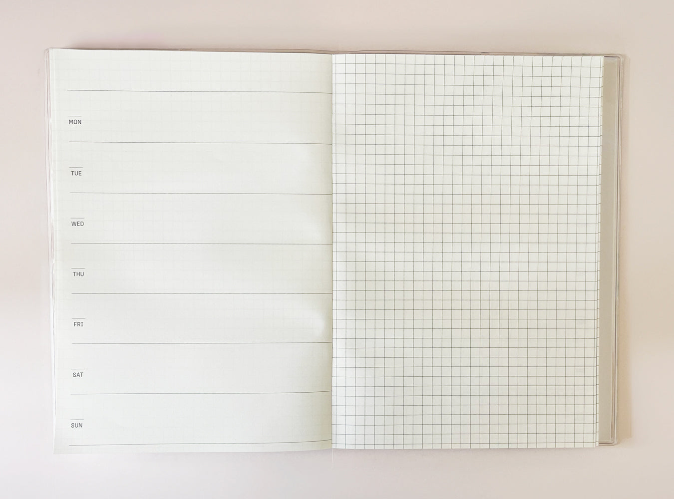 Blank diary spread with grid and lined pages