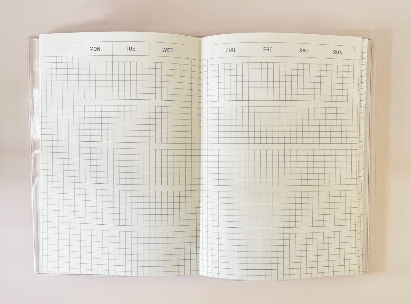 Blank diary spread with weekly grid layout