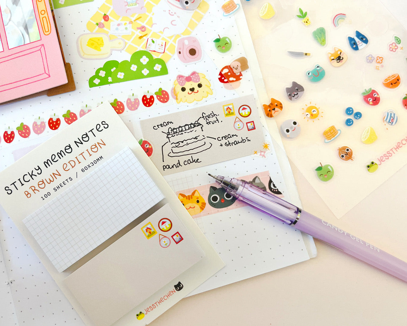 Brown sticky memo notes on a planner with stickers and pen.