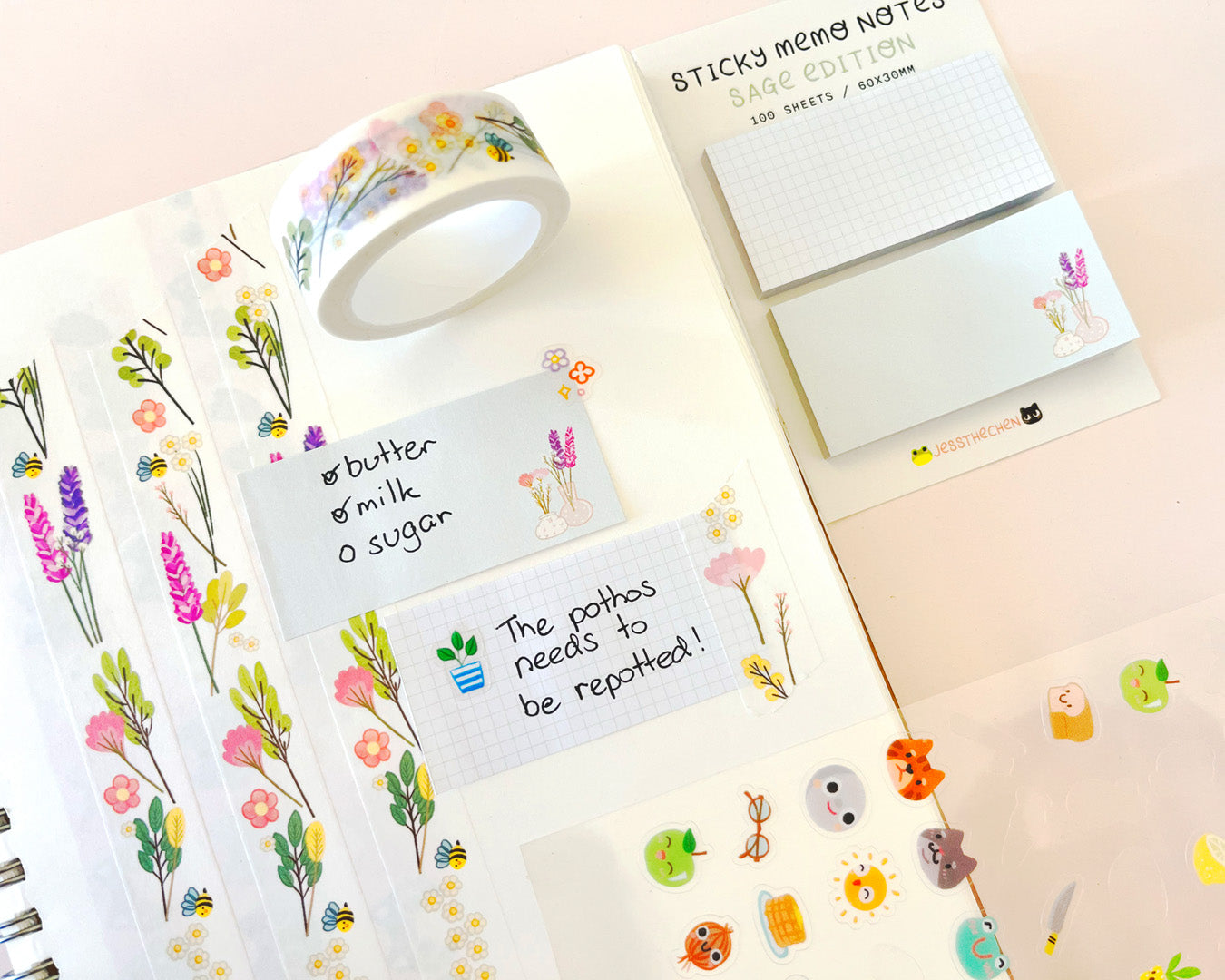 Sage sticky memo notes with floral washi tape and to-do lists.