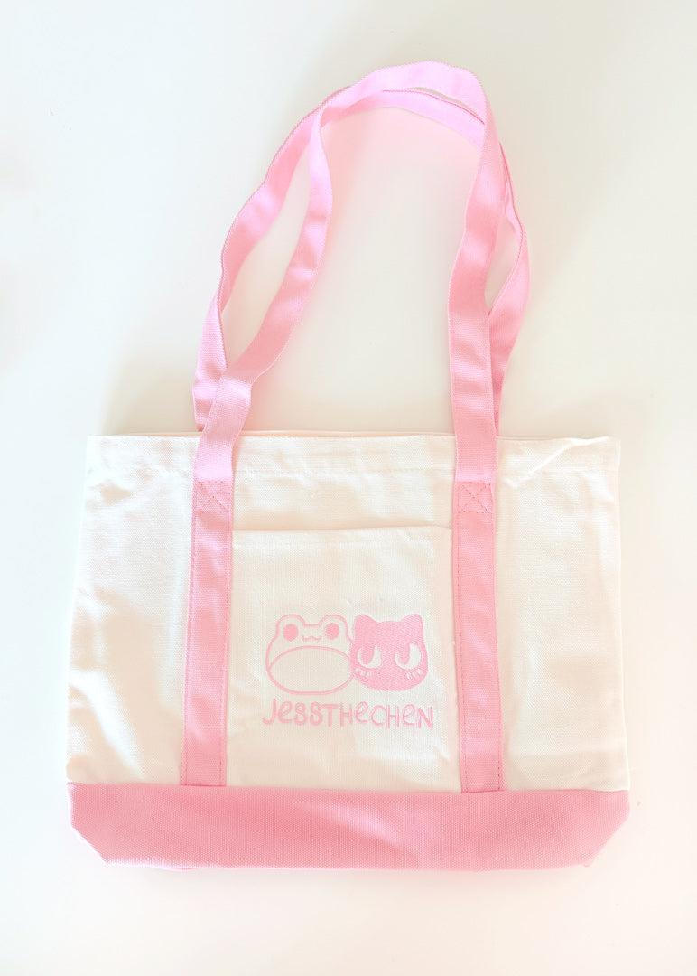 Large pink and white tote bag with frog design