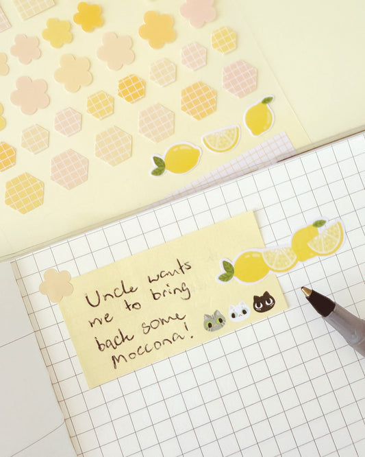 Yellow lemon stickers on notebook