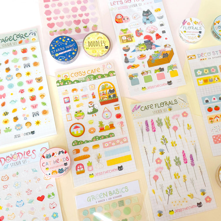 Bullet journal weekly layout with cute sticker decorations including mushroom, house and rainbow designs